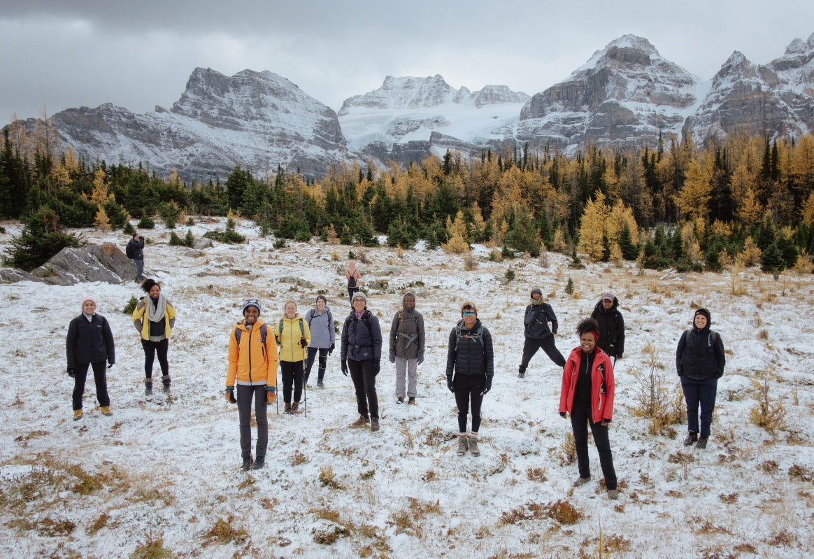 Photo of BIPOC and allied hikers in a picturesque winter mountainscape; photo copyright Pavel Boiko, Instagram @neverbadtimeforchanges